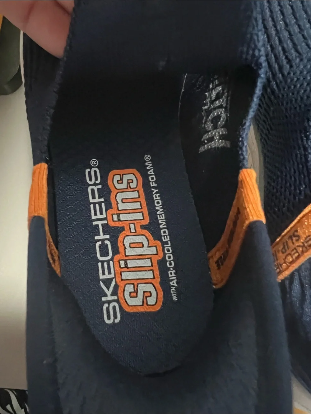 Skechers Kids Navy Slip-On Sneakers with Orange Pull Tab